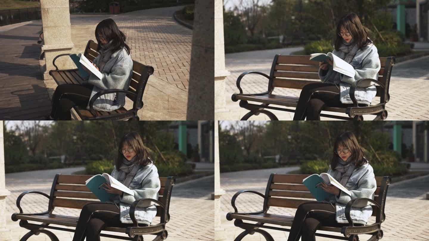 女生坐在长椅看书