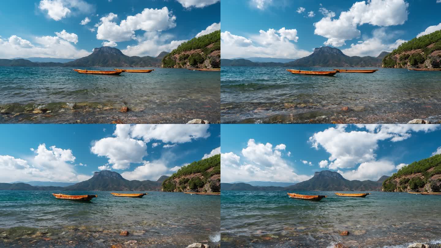 云南泸沽湖水面上的猪槽船和蓝天白云延时