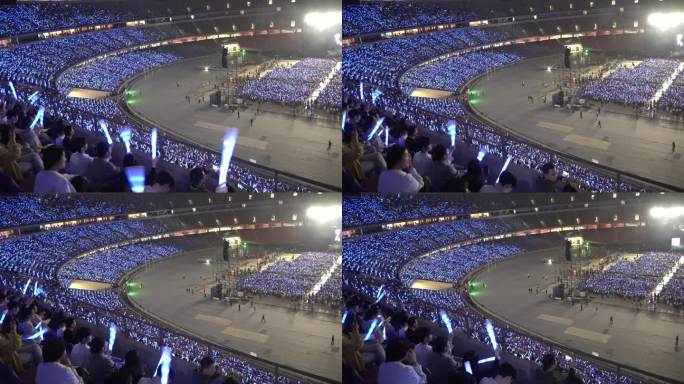 演唱会观众席歌迷挥舞荧光棒