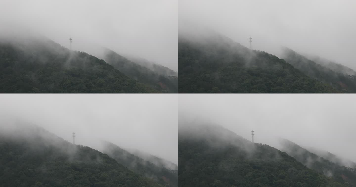 山区电塔雨中大雾
