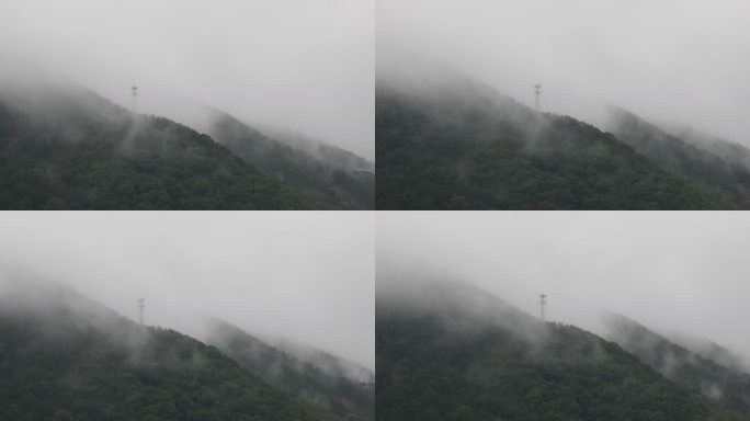 山区电塔雨中大雾