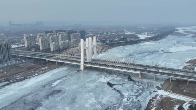 吉林珲春市森林山大桥航拍城市冬季风光