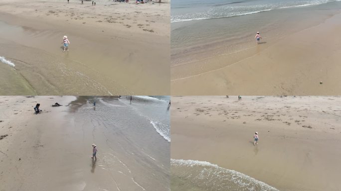 小女孩在海边玩沙子