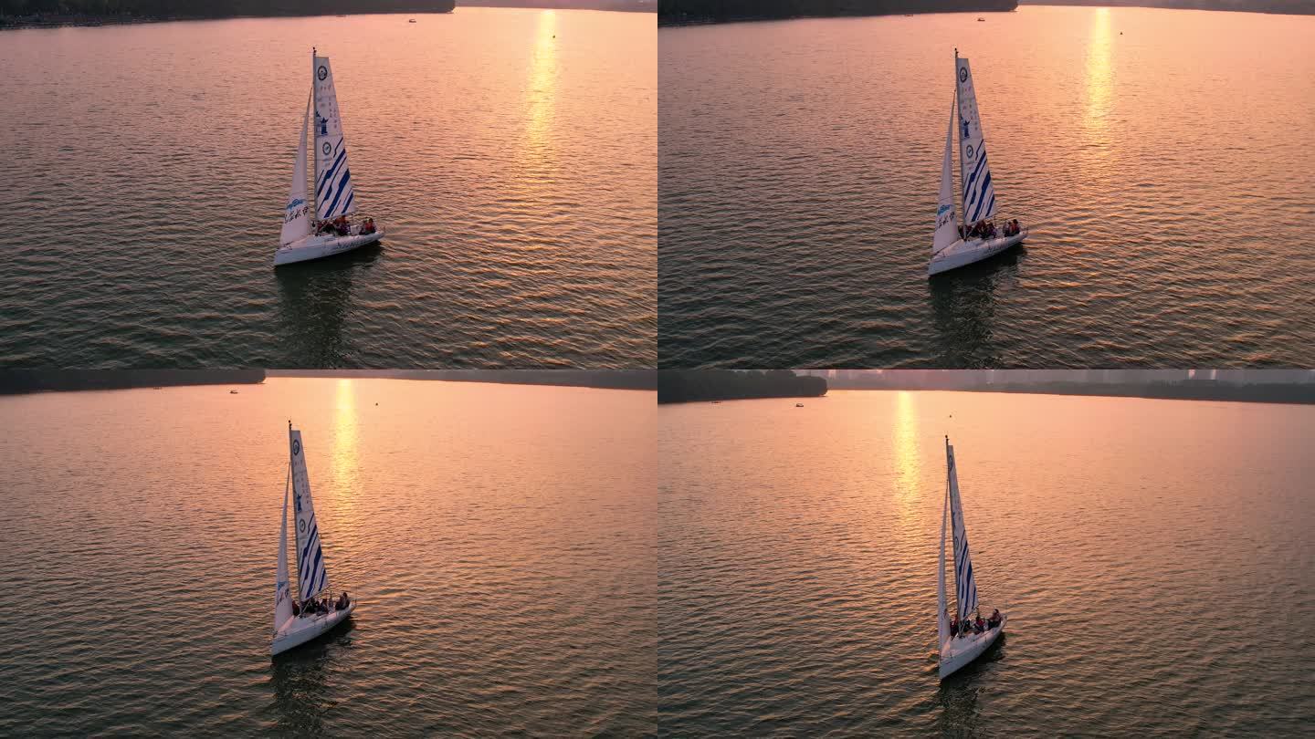 航拍夕阳下的帆船行驶 4K 60