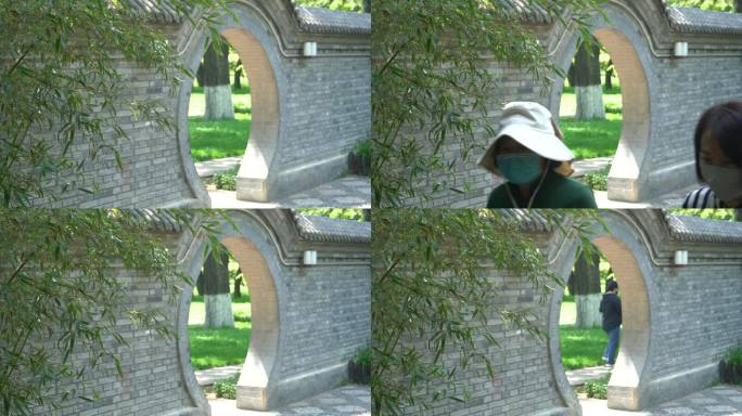 游客穿过圆形拱门人文实拍4K