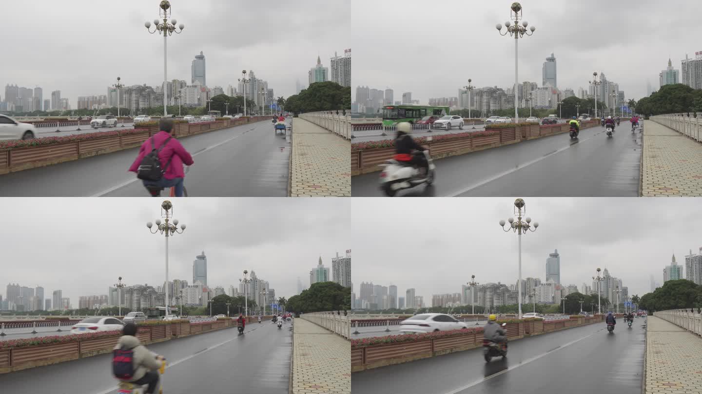 广西南宁雨天民族大道上下班车流电动车