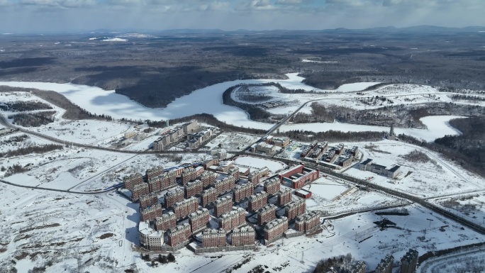 白山市抚松县城市建筑航拍冬季雪原风光