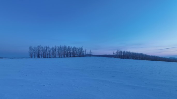 航拍4K东北雪色原野暮色