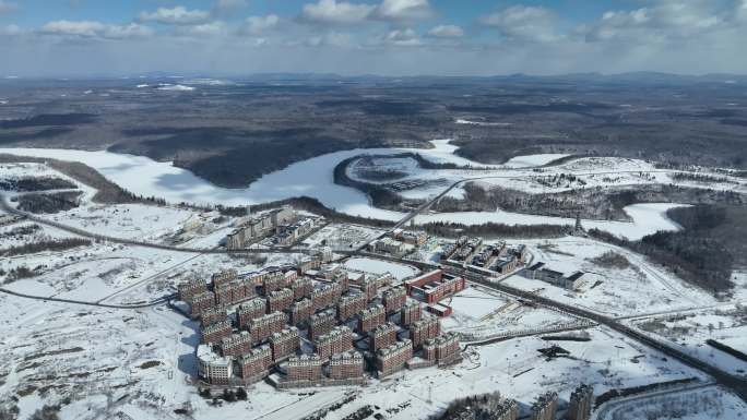 白山市抚松县城市建筑航拍冬季雪原风光