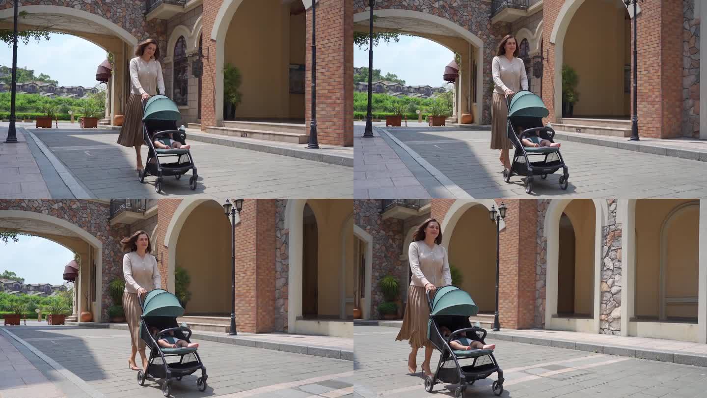 外国生活的女人推着婴儿车在街上散步