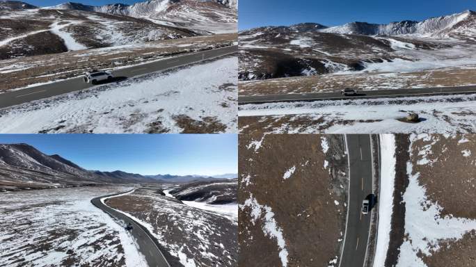 西藏雪山国道上的越野车