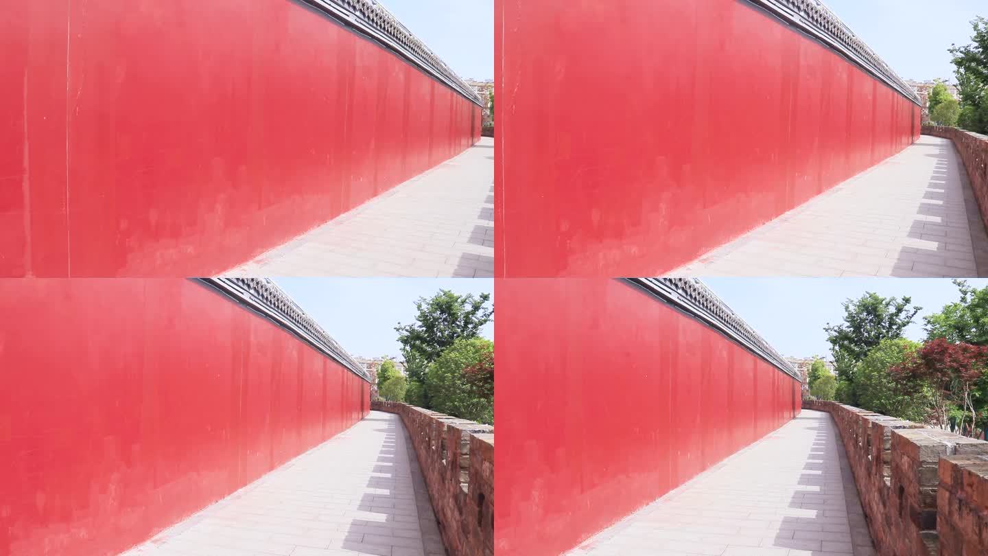 红墙色城墙砖墙外景绿树叶