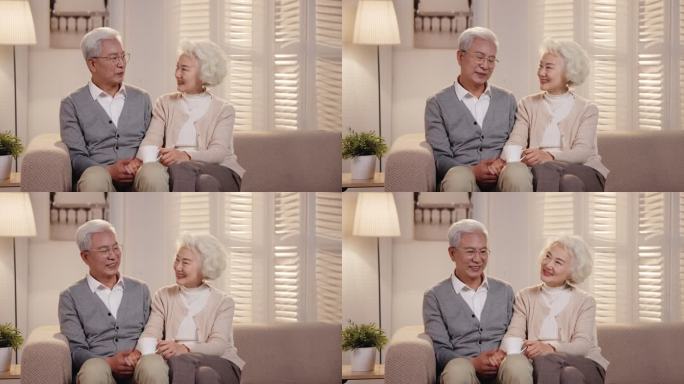 老年夫妇坐在沙发上看电视