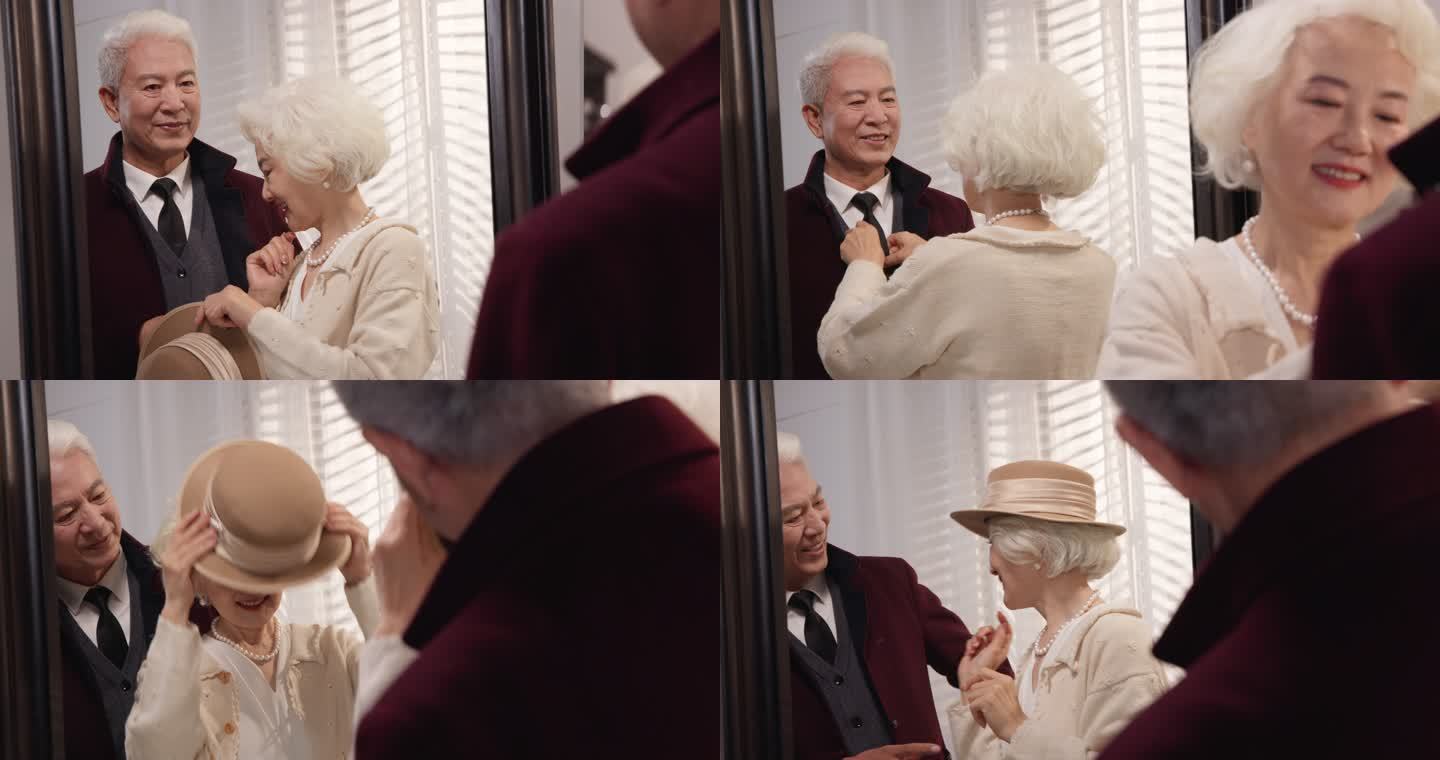 照镜子的老年夫妇打扮穿衣服