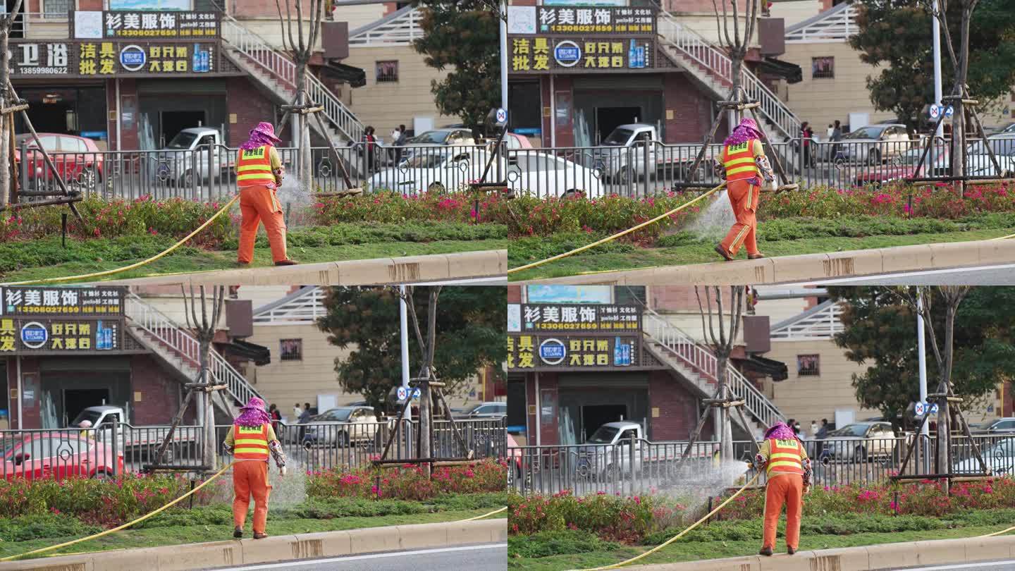 环卫工人在马路上浇花（4K50帧）
