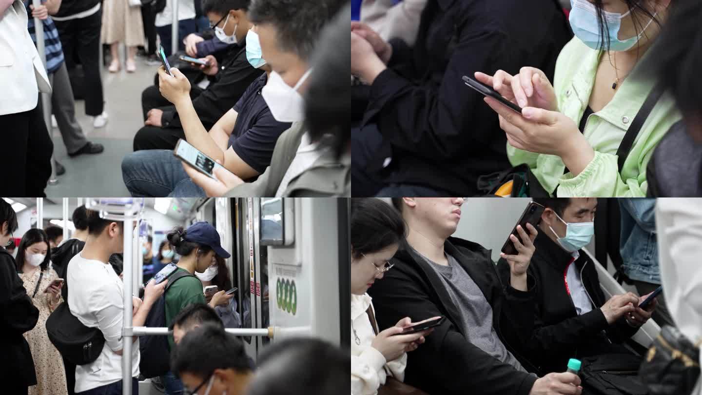 地铁低头族地铁上玩手机挤地铁上下班刷手机