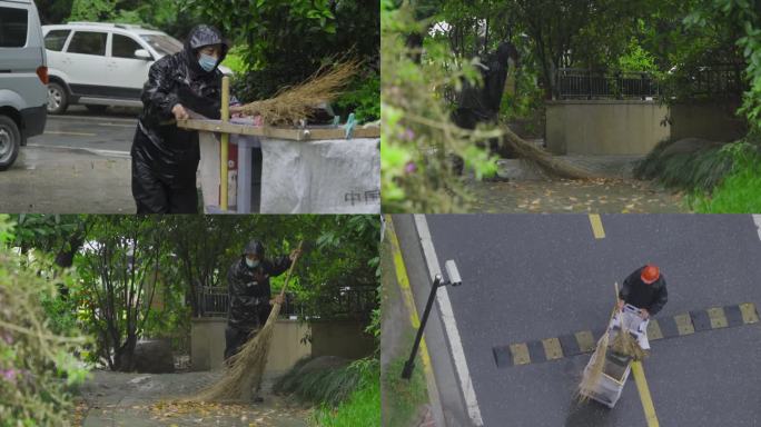 小区物业人员雨中打扫树叶