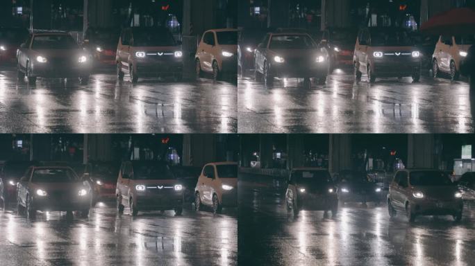 雨夜里车灯照亮雨丝和打伞的行人