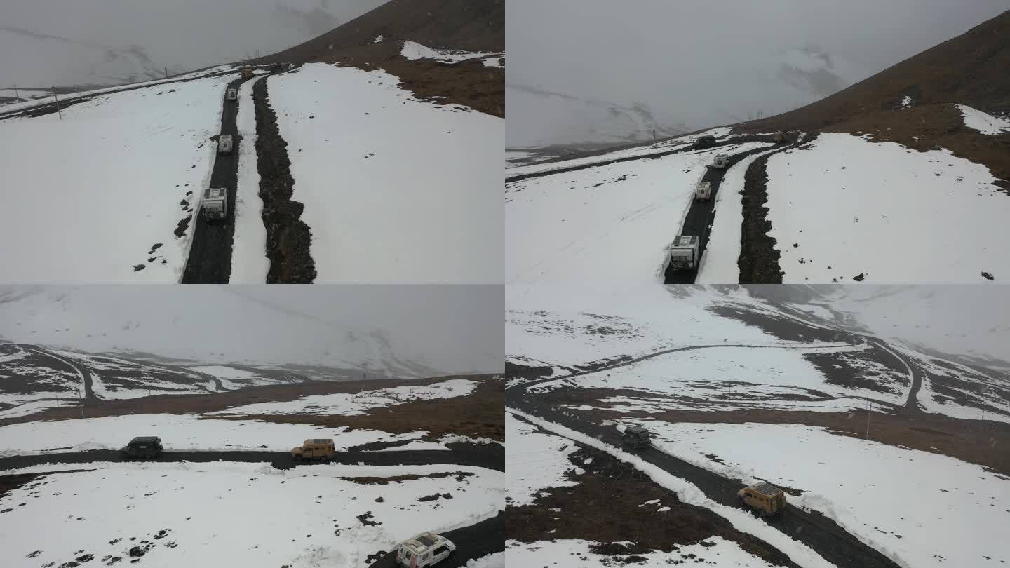 冬季西藏冰天雪地公路行驶汽车航拍