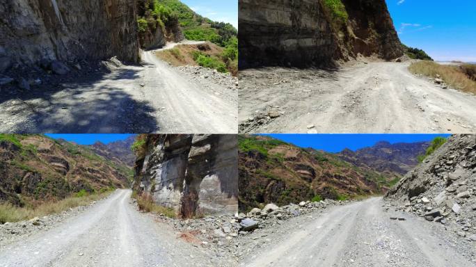 高山峡谷险峻崎岖的乡村盘山碎石土路