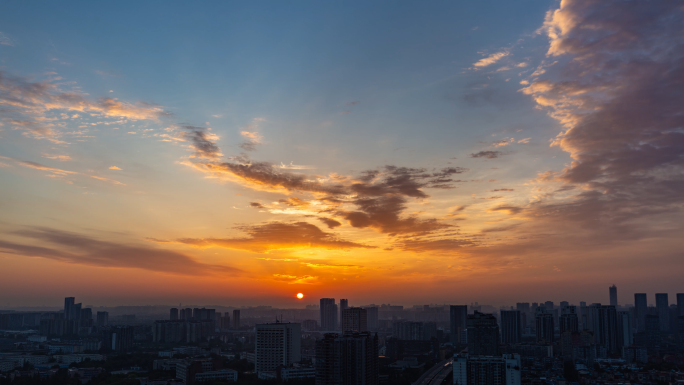 城市天亮建筑剪影城市日出朝霞彩霞天空延时