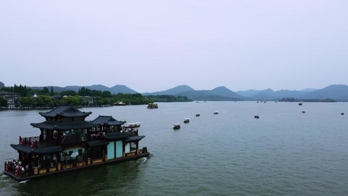 0101高清4k航拍杭州西湖游船跟拍小舟