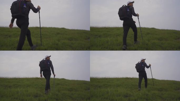 前行 登山仗 草地徒步前行跨越 翻越高山