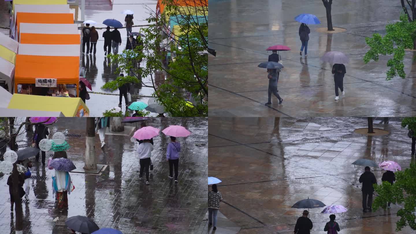 俯拍阴雨天街道打伞的行人