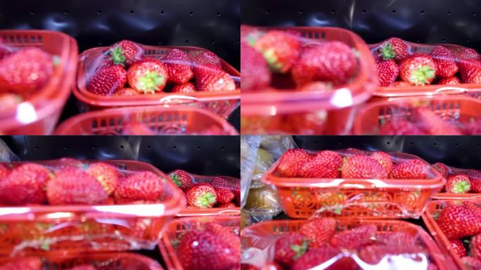 货架上保鲜盒里的草莓水果