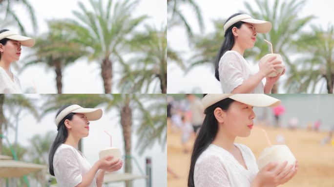 夏日海边女孩游玩喝椰汁