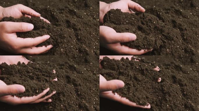 肥沃泥土土壤农民双手捧起土壤升格慢动作