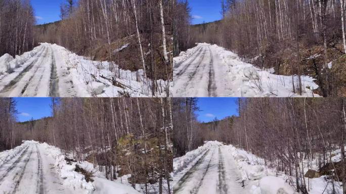 行驶在崎岖颠簸的森林雪路上