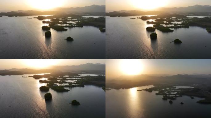 清晨日出湖中小岛渔村唯美逆光航拍
