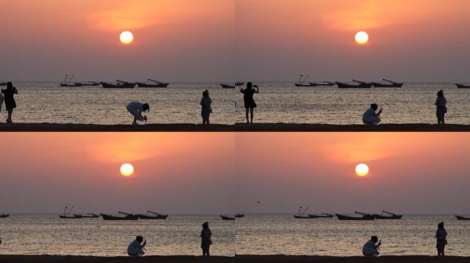 威海西海岸日落湾沙滩上拍照游玩的人