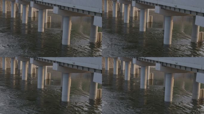 大桥桥墩下河水缓缓流动2