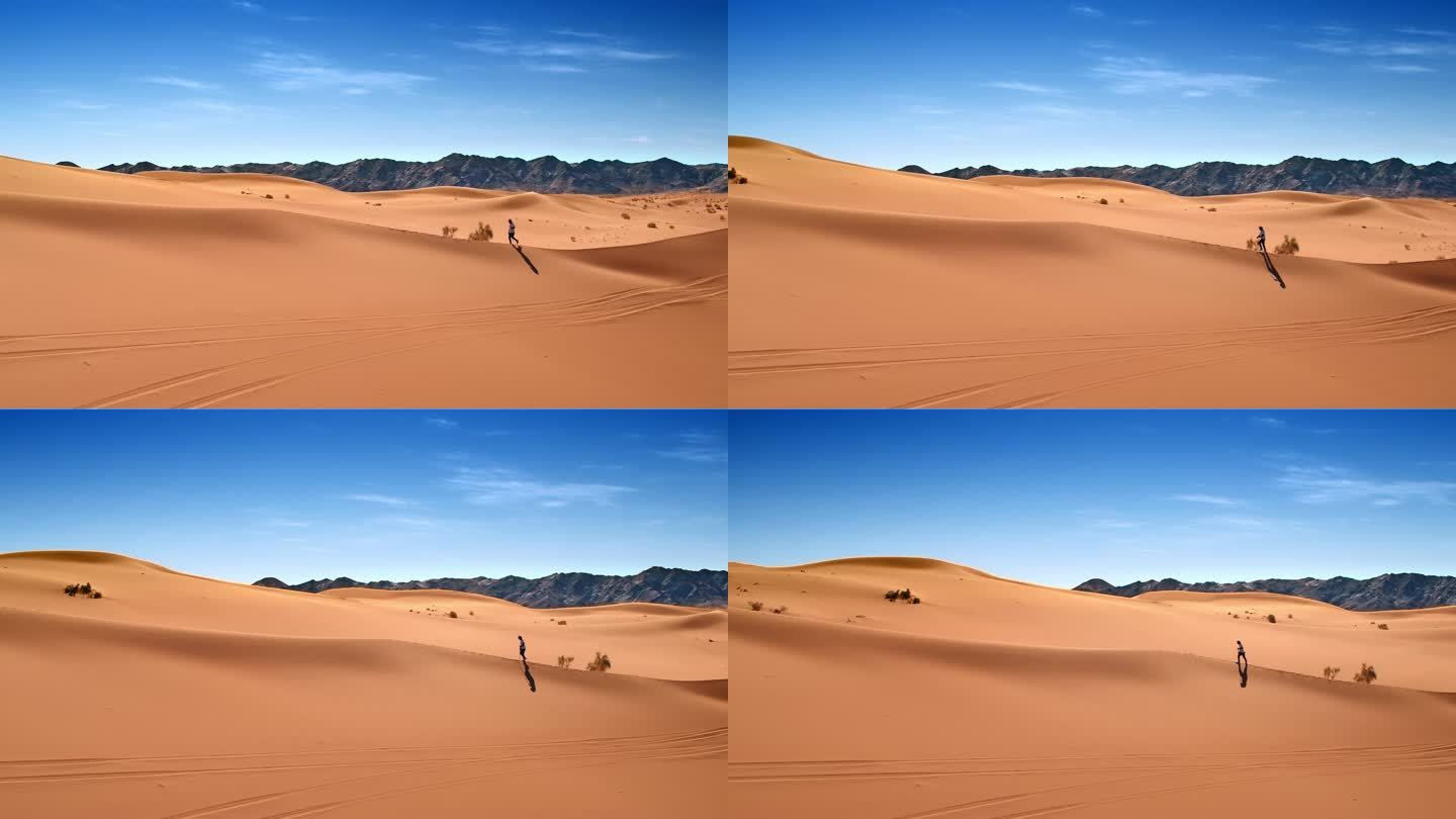 人在沙漠中行走航拍