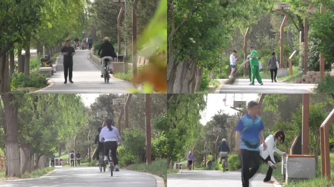 公园晨练运动骑行跑步健身退休生活清晨骑车
