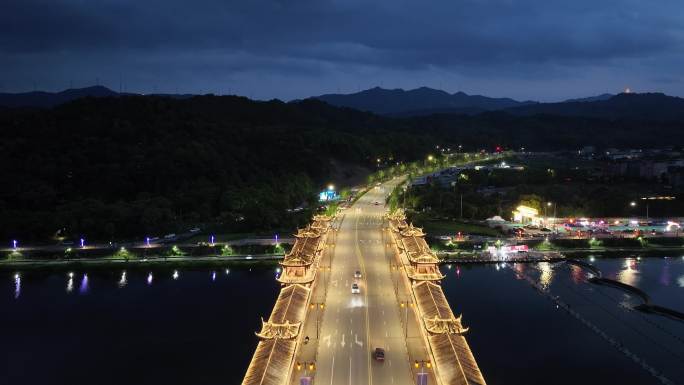 航拍宁海县城夏天傍晚兴宁廊桥夜景灯光车辆