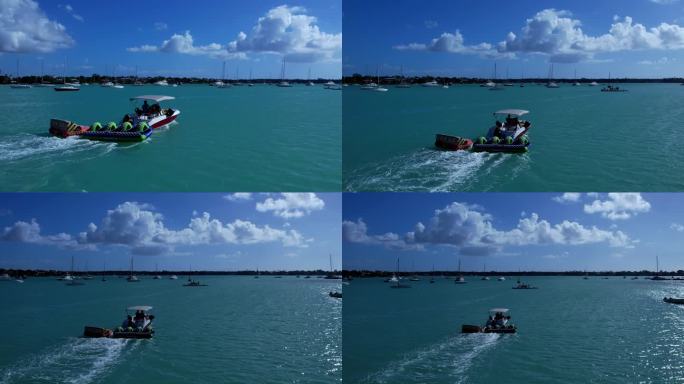 【4K航拍】蓝天白云下的大海上行驶的游船