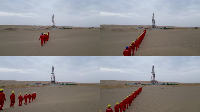 石油钻井工人沙漠里列队走向井架