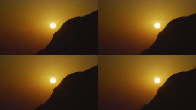 山边圆圆的日出日落夕阳
