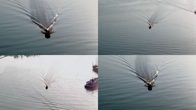 航拍无锡太湖上行驶的一支快艇湖面水波纹