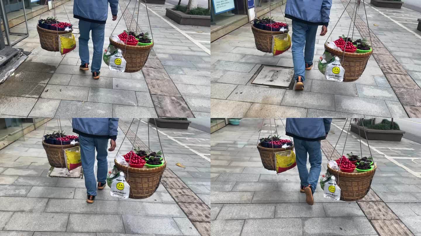 城市街头挑水果杨梅小番茄沿街贩卖实拍素材