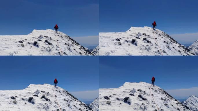 登顶四川阿坝岷山山脉主峰雪宝顶的登山者