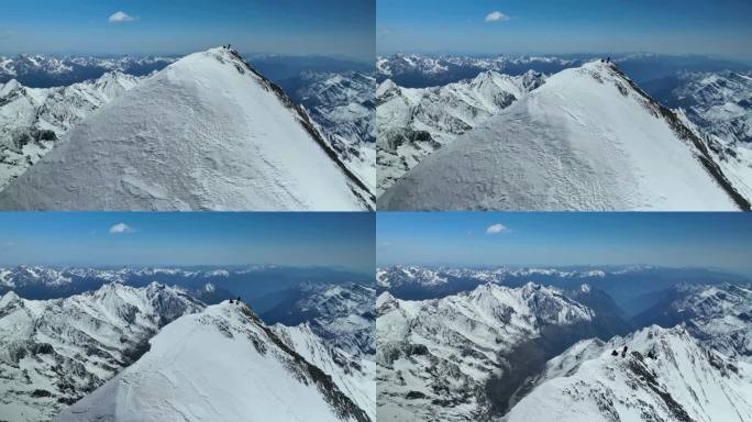 航拍登顶阿坝岷山山脉主峰雪宝顶的登山者