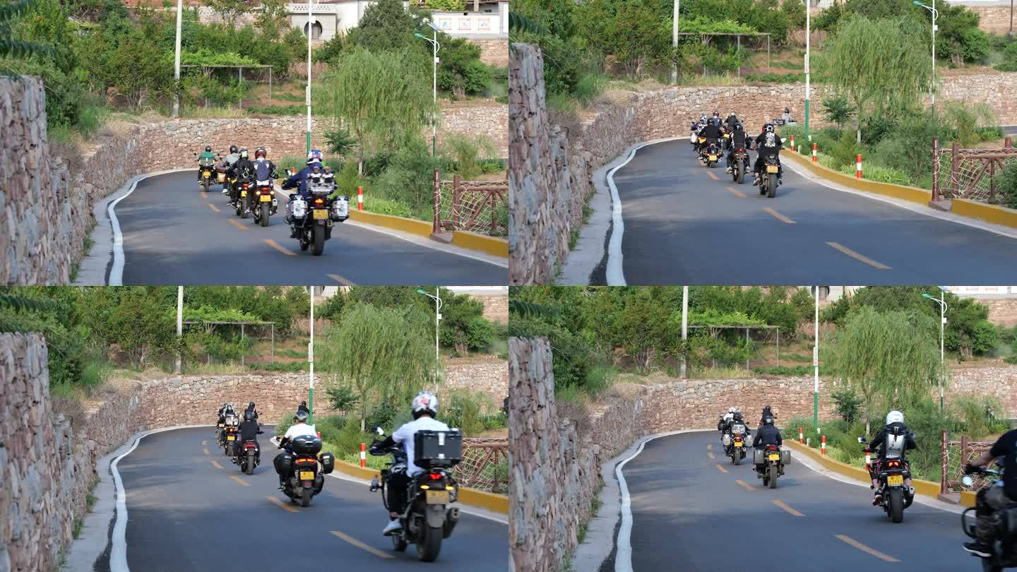 摩托车队行驶在乡村道路