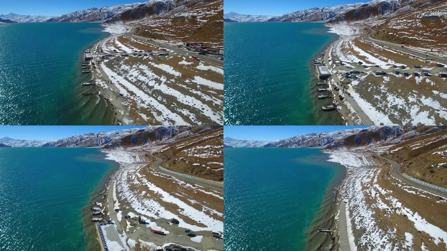 航拍西藏羊湖蓝色湖水与雪山、羊卓雍措