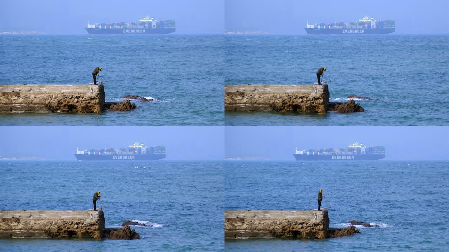 海边垂钓的老人和集装箱货轮