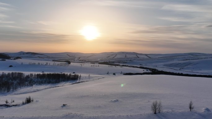 航拍高寒山地雪野日落