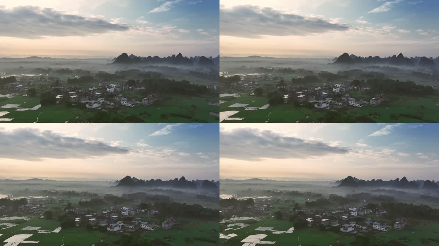 日出时分桂林的村庄和稻田上漂浮着一层薄雾